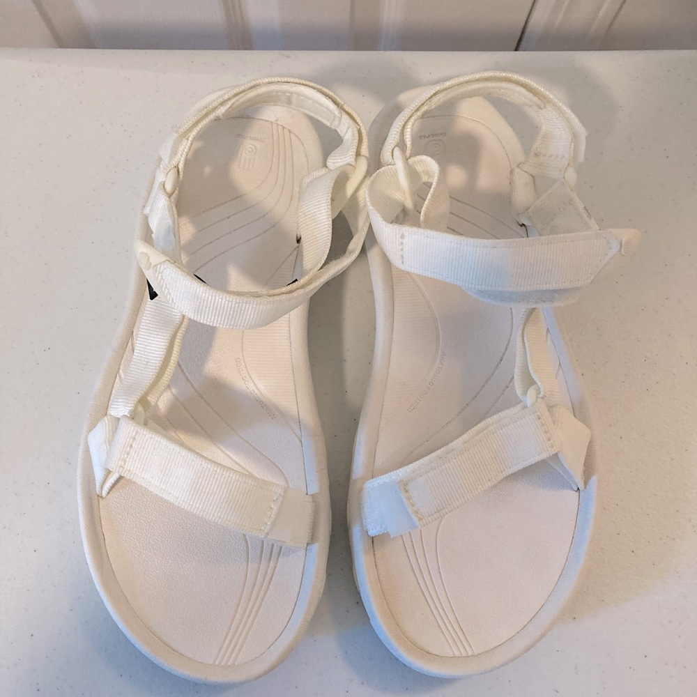 White Teva hurricane sandals